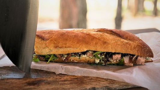 featured image of A Symphony of Flavors Pork and Caramelized Onions Sandwich